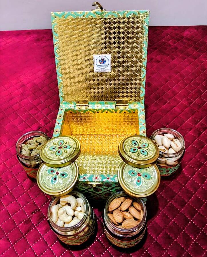 Open turquoise Maruti Gifts box with dry fruit jars